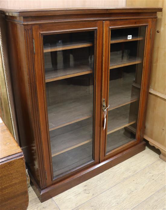 An Edwardian walnut glass fronted bookcase W.91cm